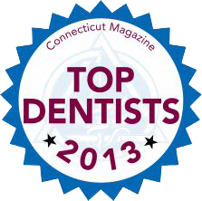 The image features a badge with text indicating  Top Dentists 2013  and the Connecticut Magazine logo, suggesting an award for dental professionals.